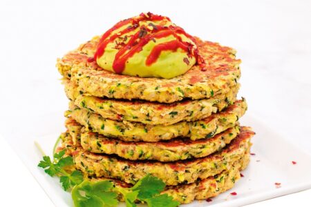 Quick and Crispy Zucchini Fritters with Avocado Crema Recipe from Vegan Comfort Cooking Cookbook